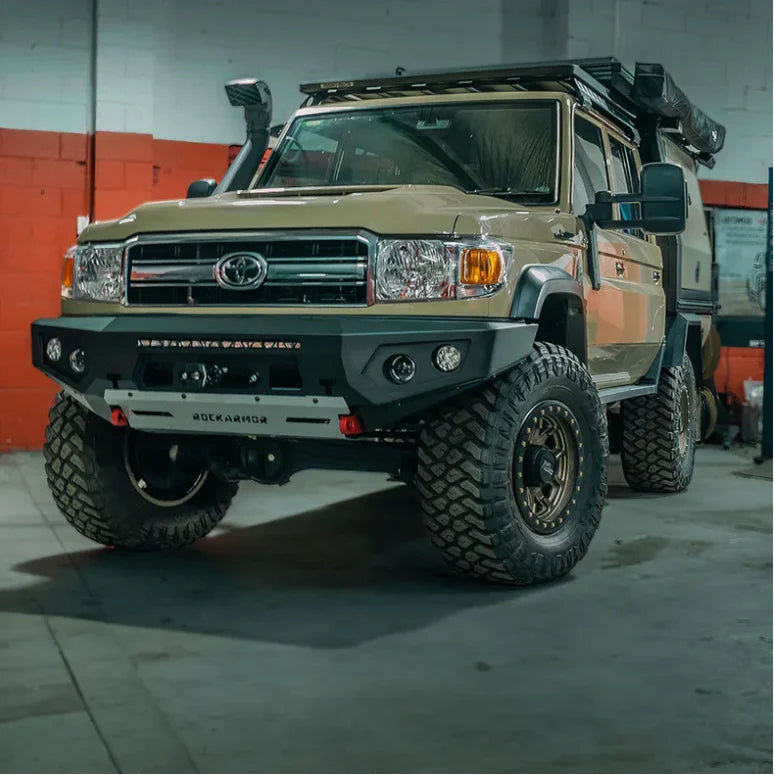 Tan toyota landcruiser equipped with rockarmor gt steel hoopless bullbar for off-road protection and durability