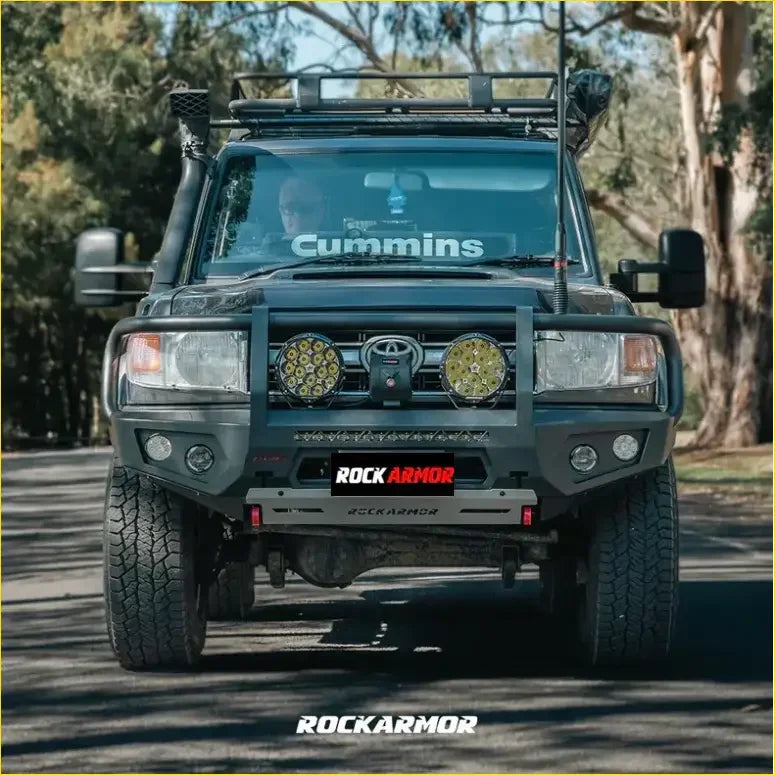Black toyota land cruiser with rockarmor front bumper and dual circular led lights from rockarmor rock pack