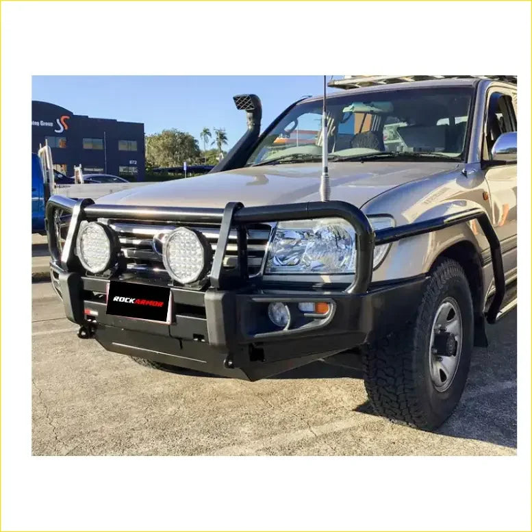 Black rockarmor front bumper for toyota landcruiser fj100 with integrated circular led lights and rugged protective design