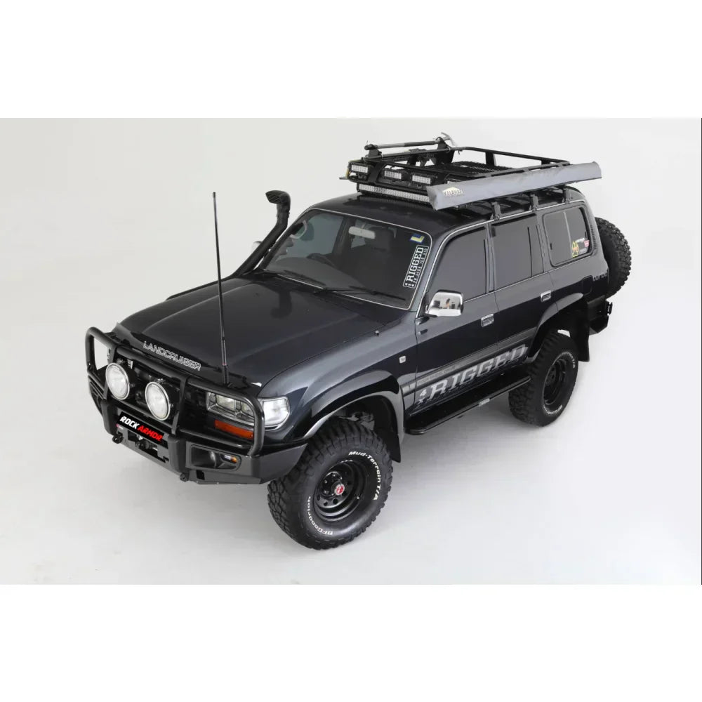 Black Toyota Landcruiser Fj80 with rockarmor premium steel bullbar and roof rack featuring led fog lights